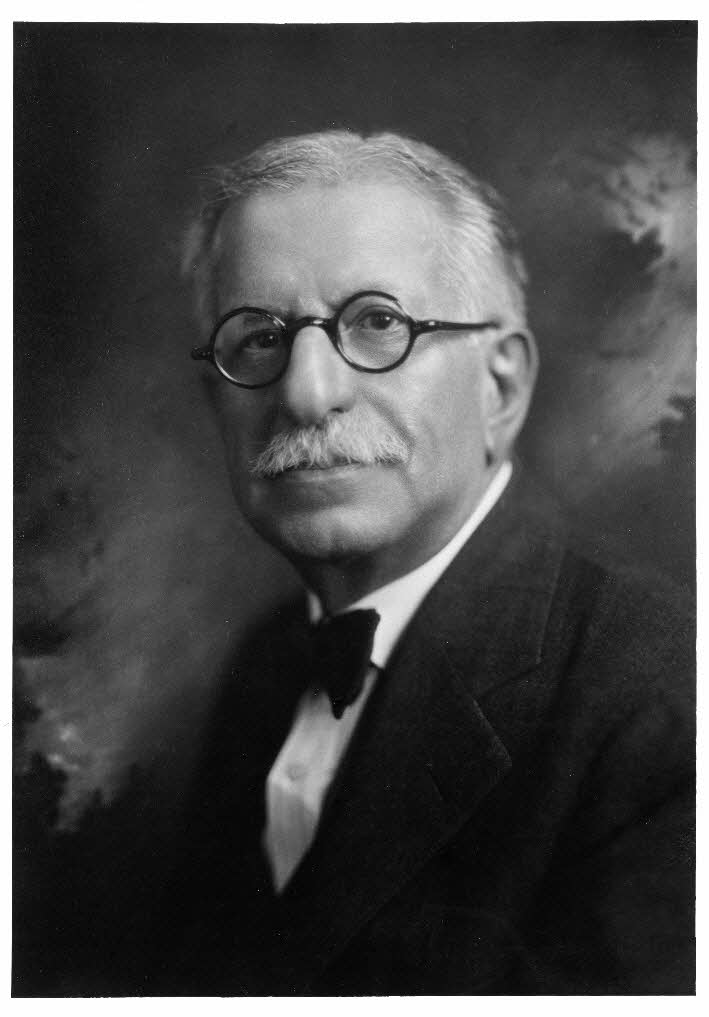 A portrait photograph of Dr. Henry Wolfner.