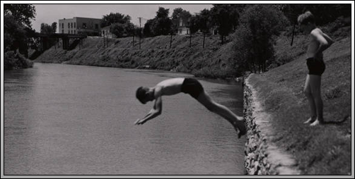 Boys diving into the Black River